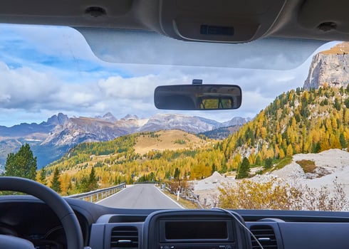 view-alps-through-windscreen-car-while-driving-curvy-road
