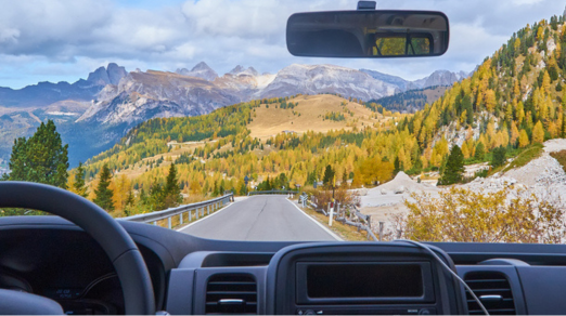 view-alps-through-windscreen-car-while-driving-curvy-road_Feature